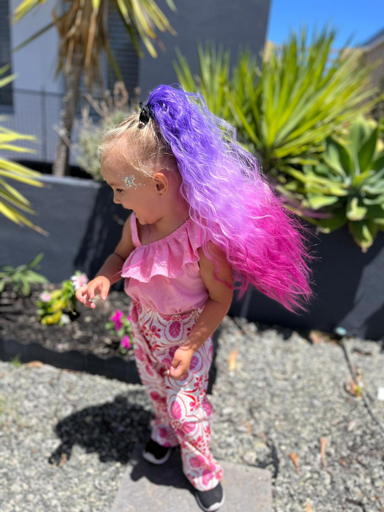 Purple Rain Wavy Ponytail wear by a little girl