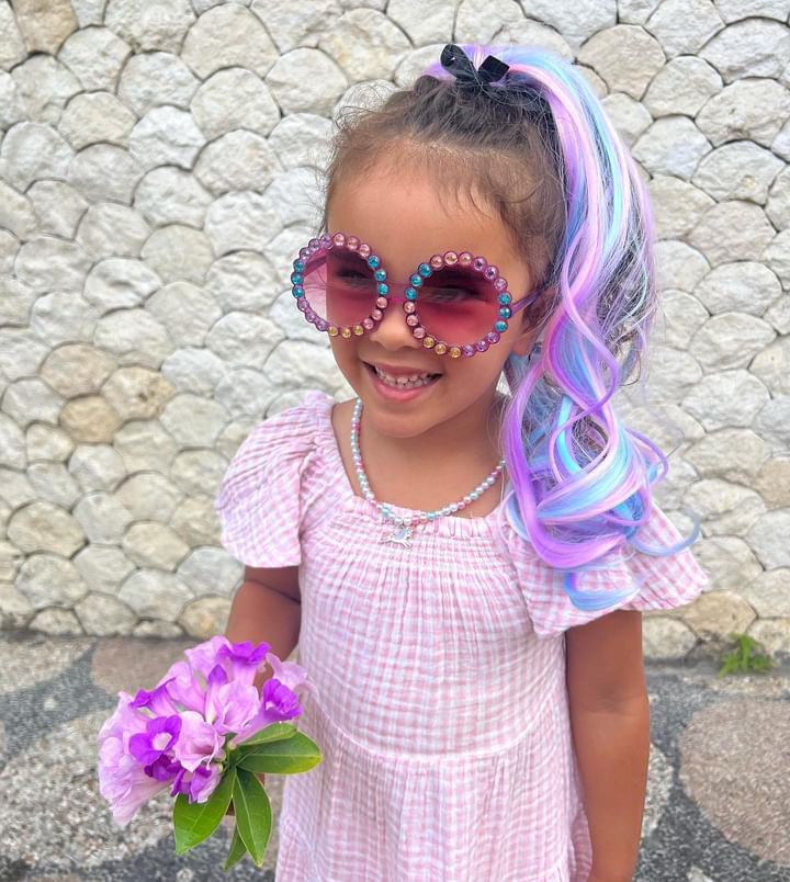girl wearing purple retro glasses