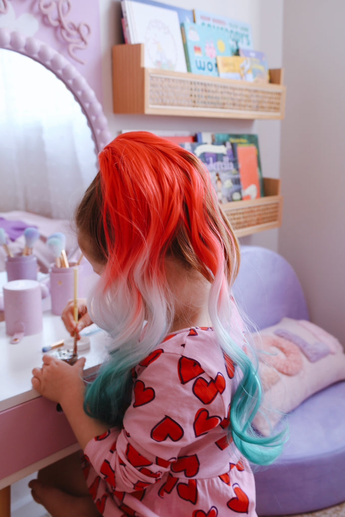a little girl wearing Candy Cane Curled Ponytail