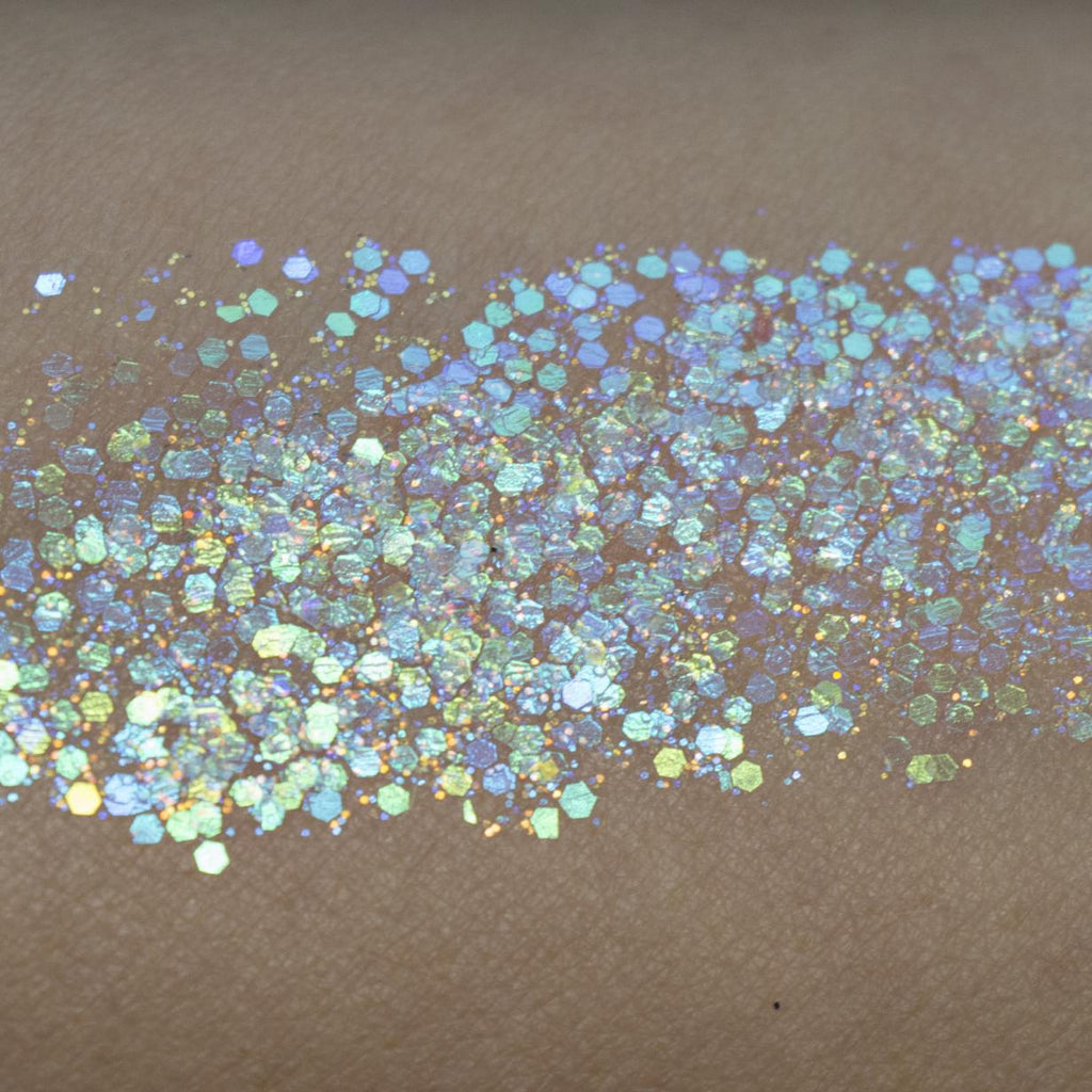display of Illumine Glitter Balm on plain surface