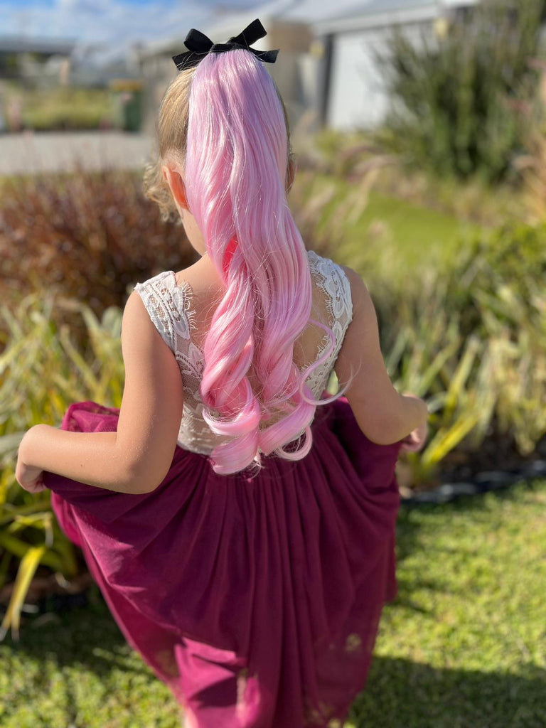 girl in Blush Curled Ponytail