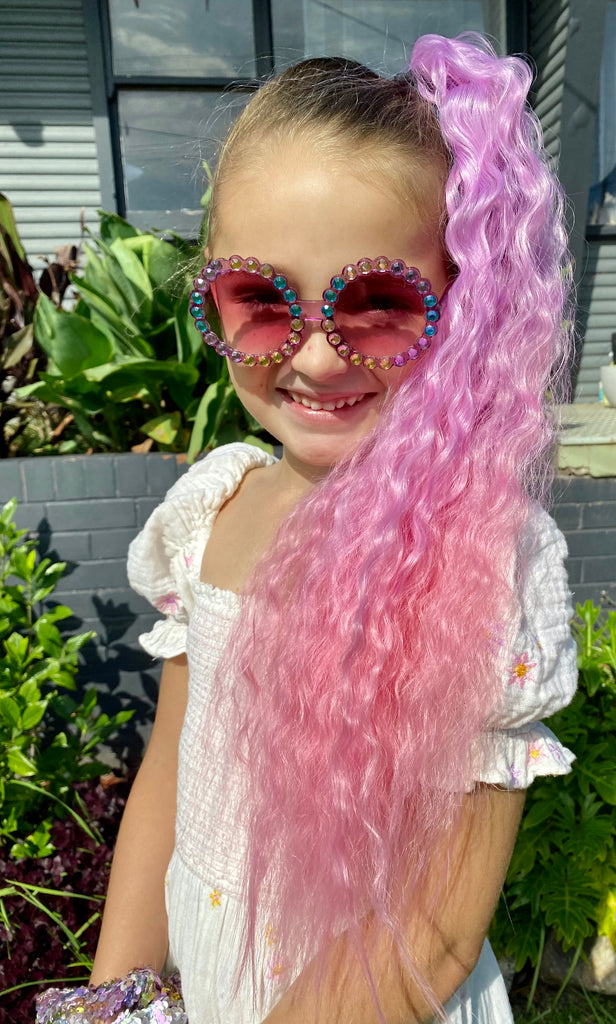girl is wearing Coral Wavy Mermaid Ponytail