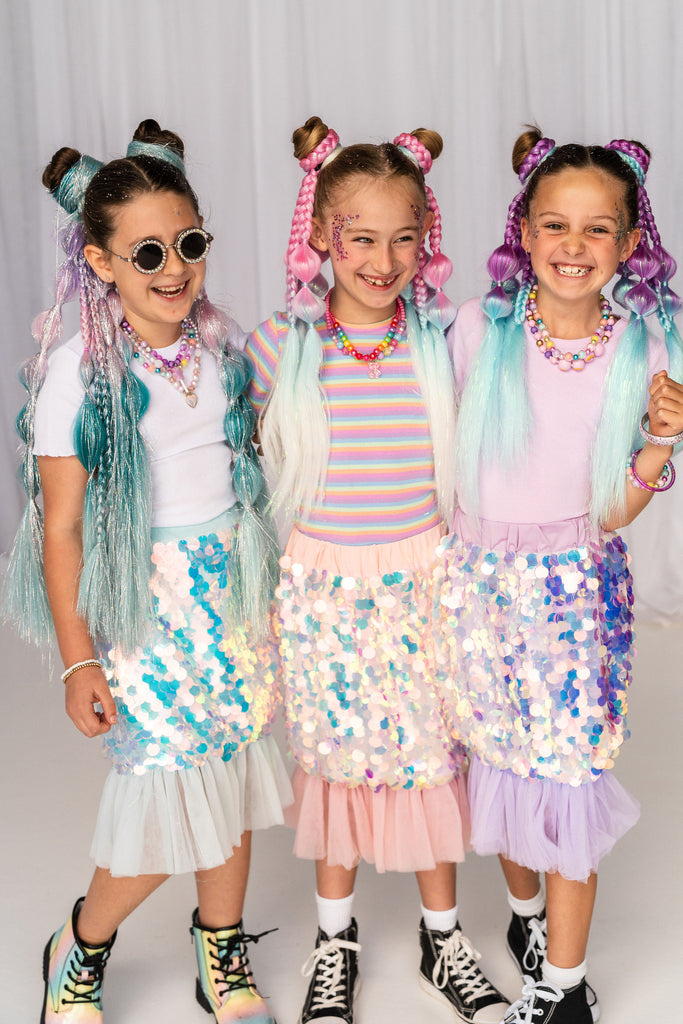 Three little girls wearing Blush Sequin Mermaid Skirt in different colors