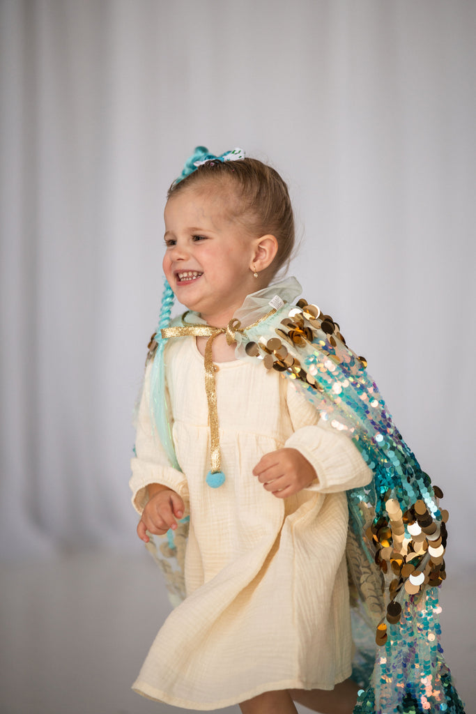 girl in Blue Sequin Cape