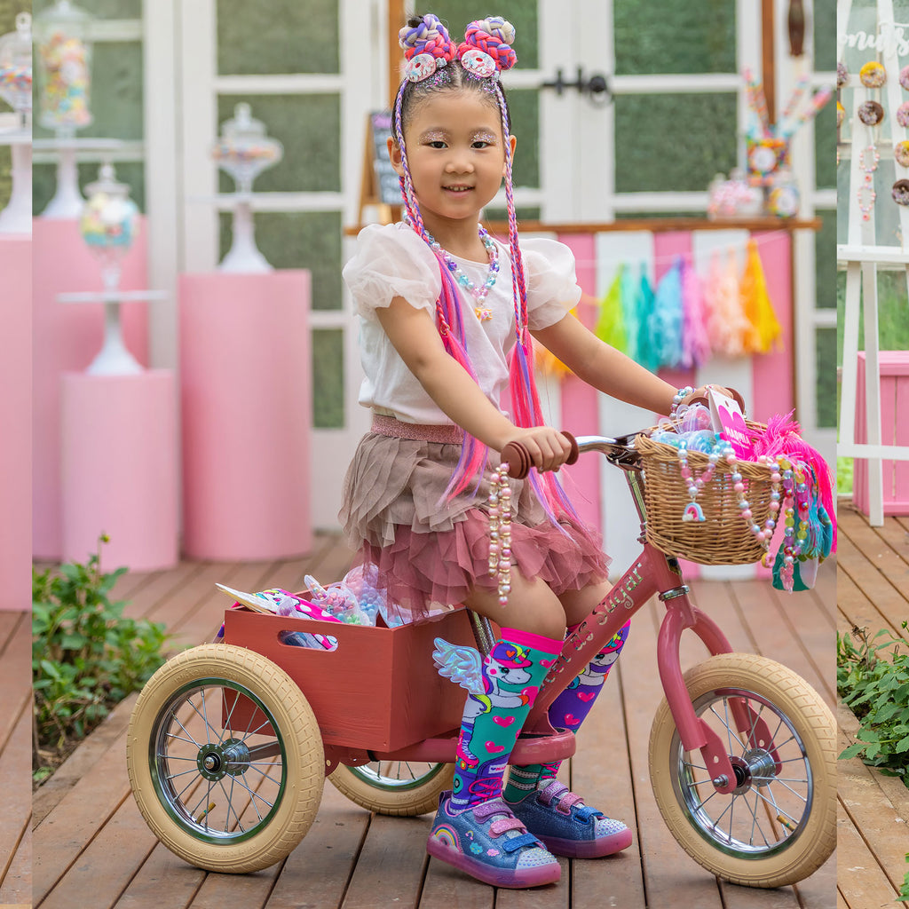 girl is on cycle while wearing Skatercorn Socks