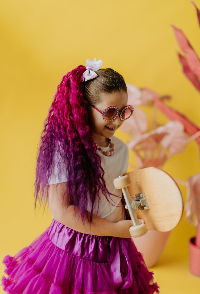 Calypso Wavy Mermaid Ponytail-wearing by a little girl