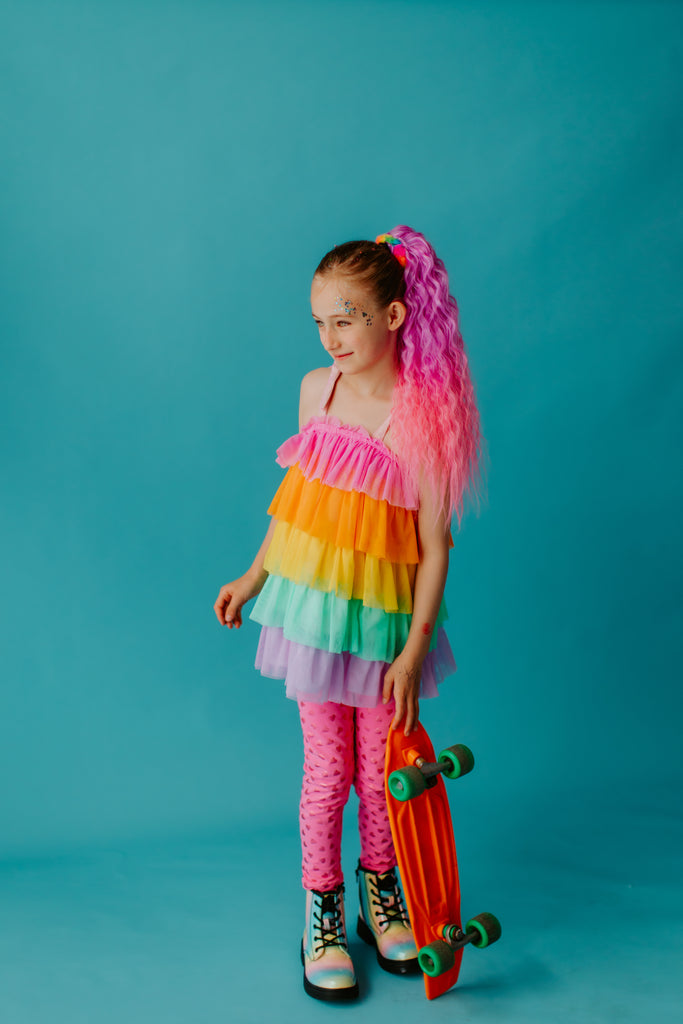 girl is wearing Coral Wavy Mermaid Ponytail