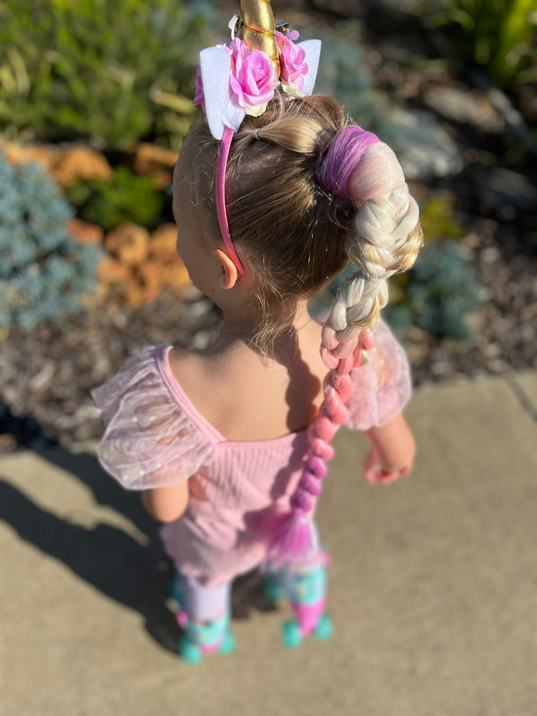 rear look of little girl In Pink Straight Ponytail